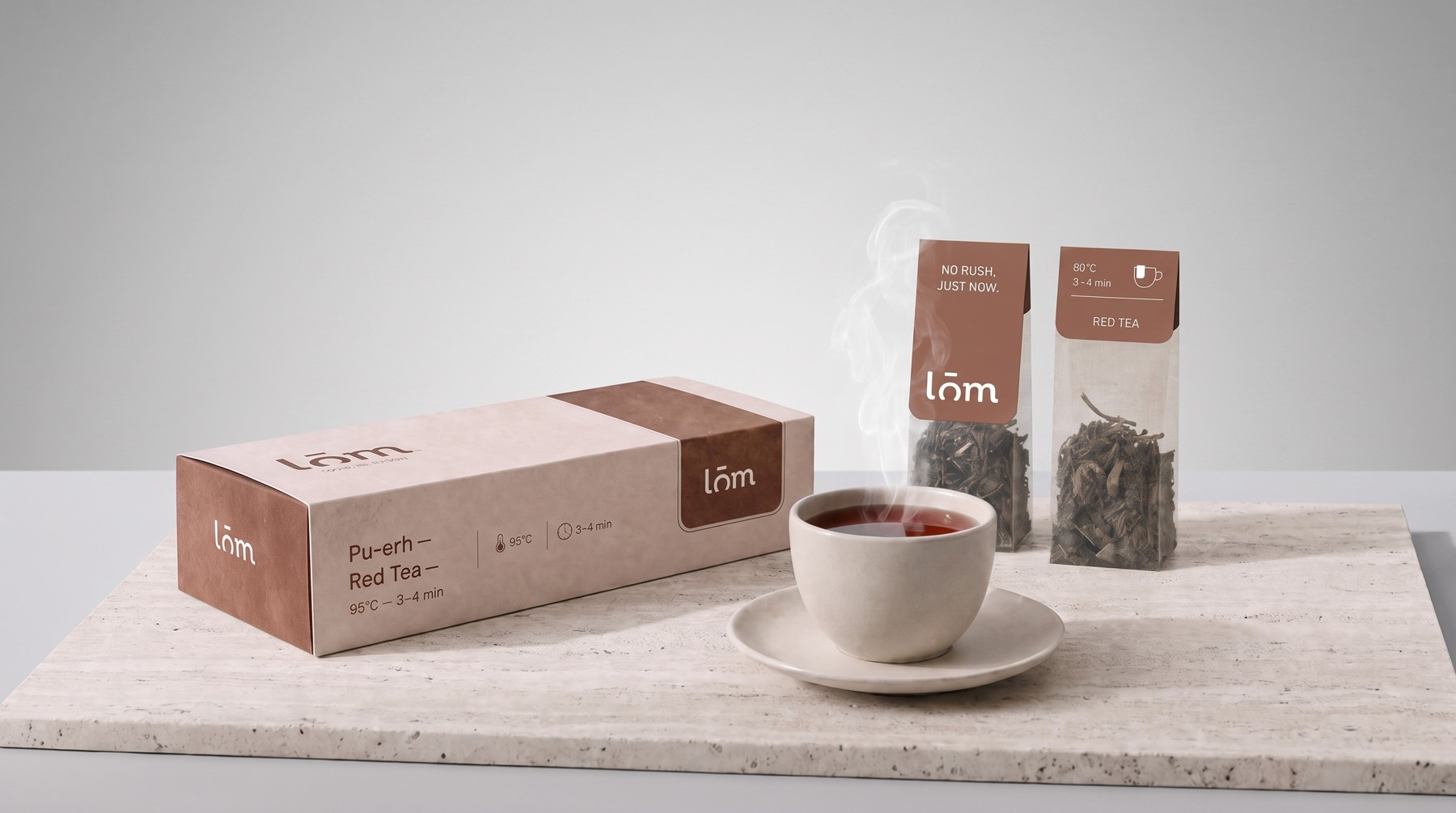 Caja y sobres individuales de té LŌM Pu-erh, empaque en tono terracota
